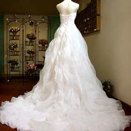 Sweetheart Organza A-line Wedding Dress Featuring..